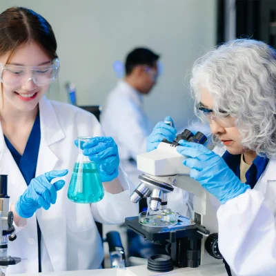 scientists-in-lab-coats-collaborating